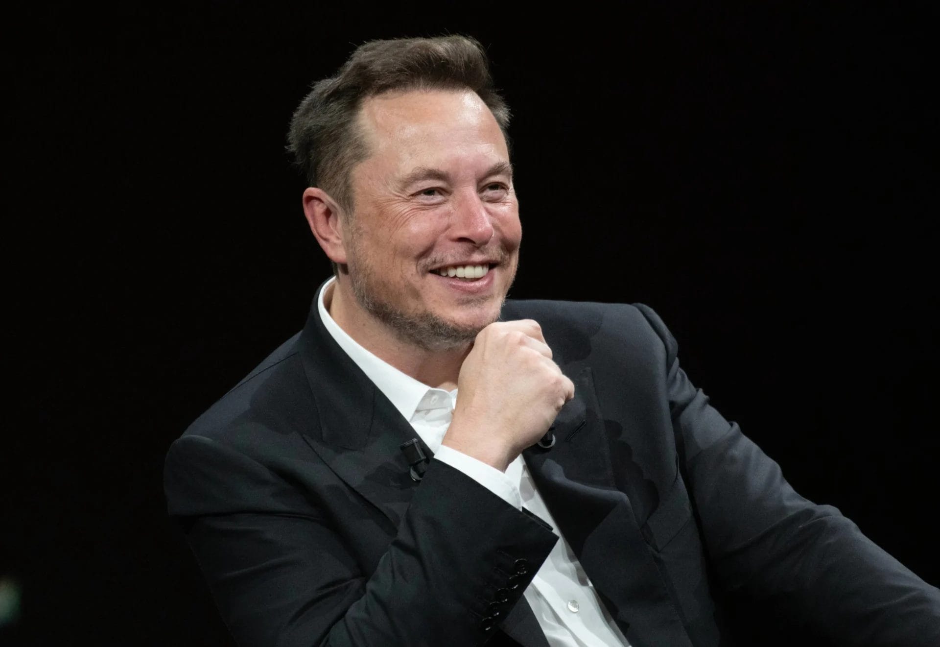 Elon Musk in recent years, showing visibly fuller hair compared to his appearance in his late 20s.